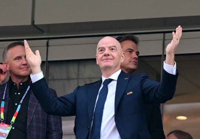 115247538-fifa-president-gianni-infantino-reacts-during-the-2026-world-cup-group-d-football-match-be